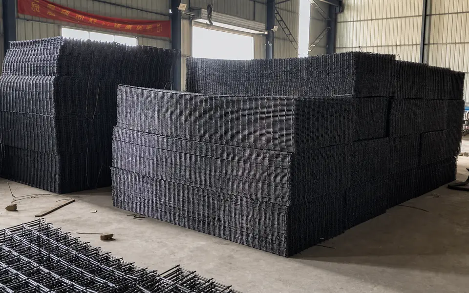 Stacked welded steel mesh panels inside the Xianhong Mining workshop