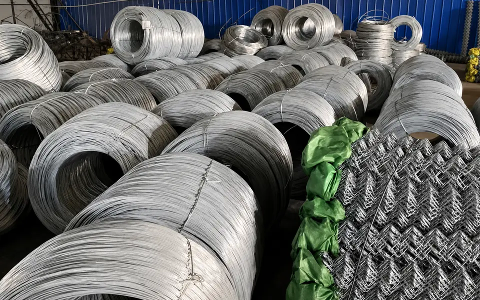 Wire coils and stacked mesh materials stored inside the Xianhong Mining workshop